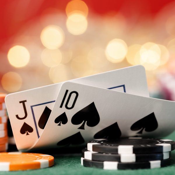 Playing cards on poker table background close up Playing cards on poker table background close up photo